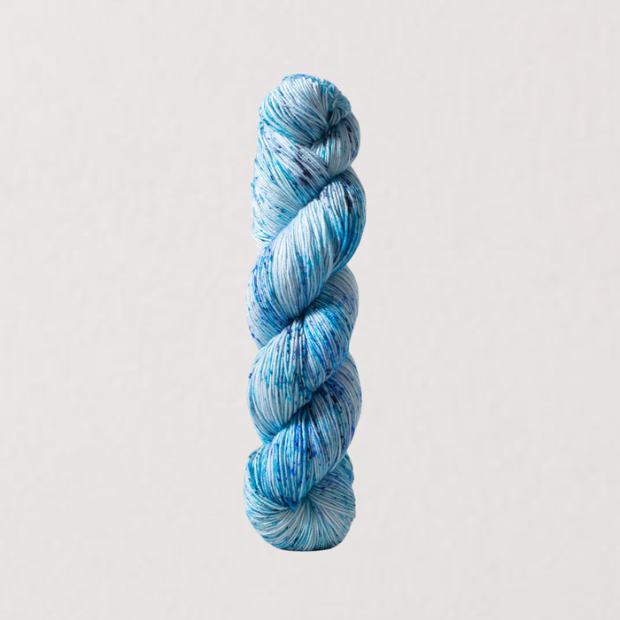 Blue skein of yarn on a light gray background