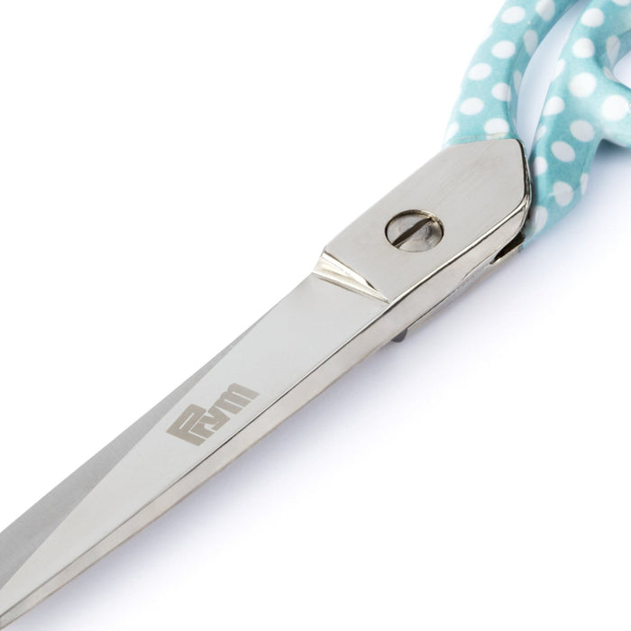 Close up of Prym textile scissors on a white background
