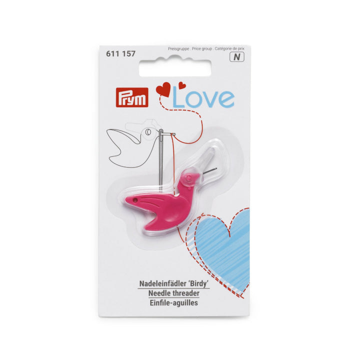 Pink needle threader on a white packaging with Prym branding