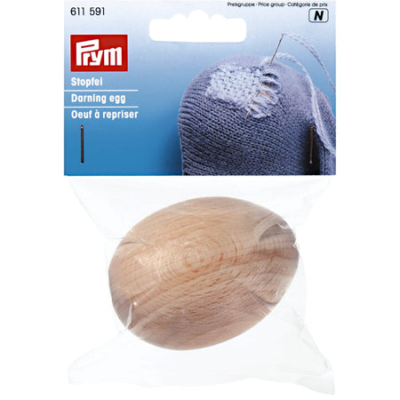 Darning egg in packaging on a white background