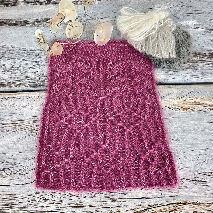 Knitted fabric with a textured pattern on a wooden surface