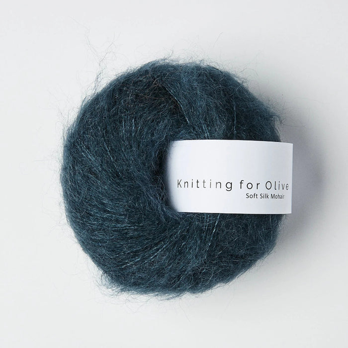 Blue skein of yarn with 'Knitting for Olive' label on a white background