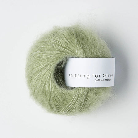 Ball of green yarn with 'Knitting for Olive' label on a white background
