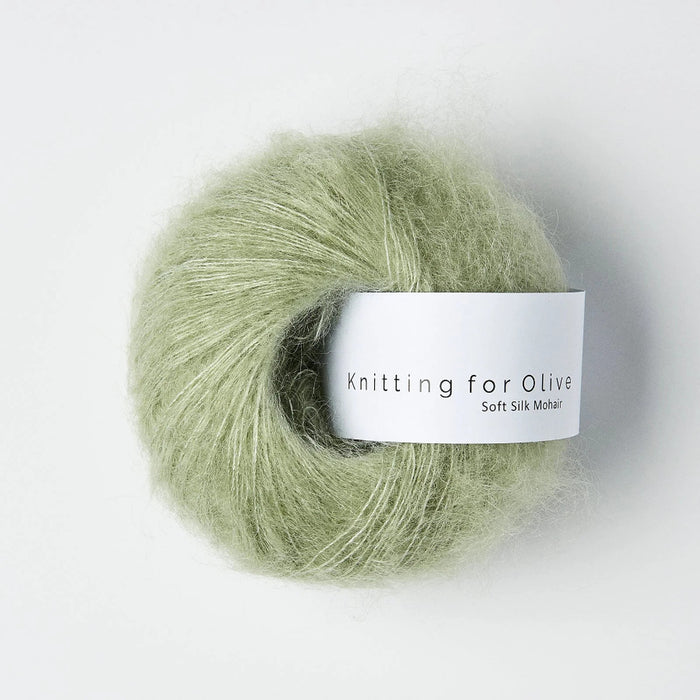 Ball of green yarn with 'Knitting for Olive' label on a white background