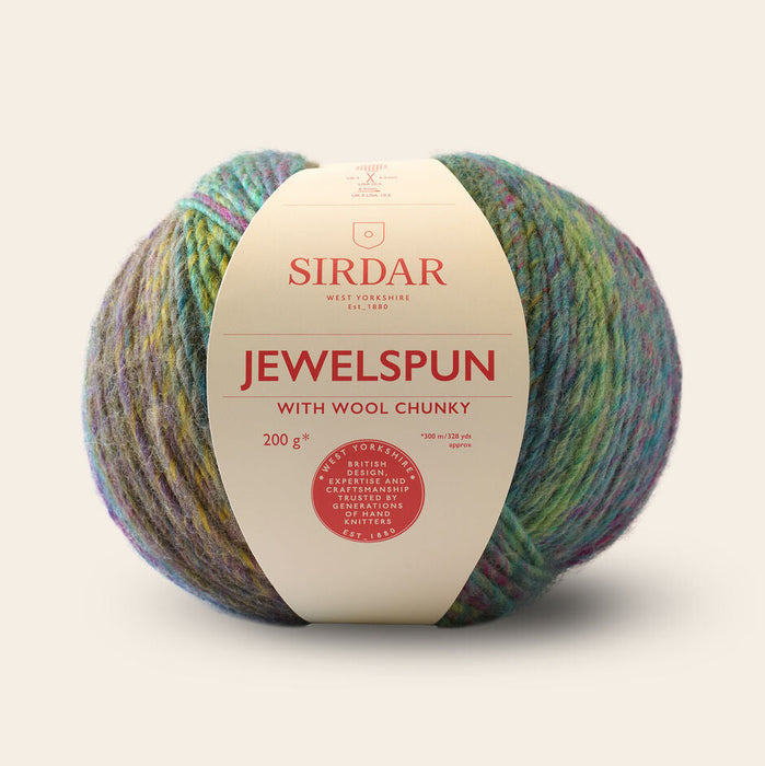 Multicolored ball of yarn with a Sirdar label on a beige background