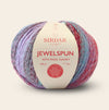 Multicolored ball of yarn with Sirdar label on a beige background