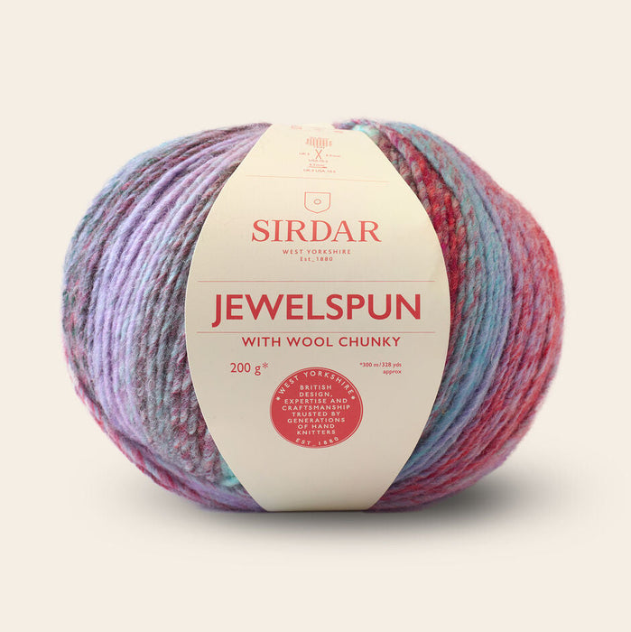 Multicolored ball of yarn with Sirdar label on a beige background
