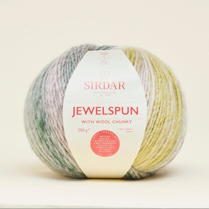 Sirdar Jewelspun yarn ball with label on a light background
