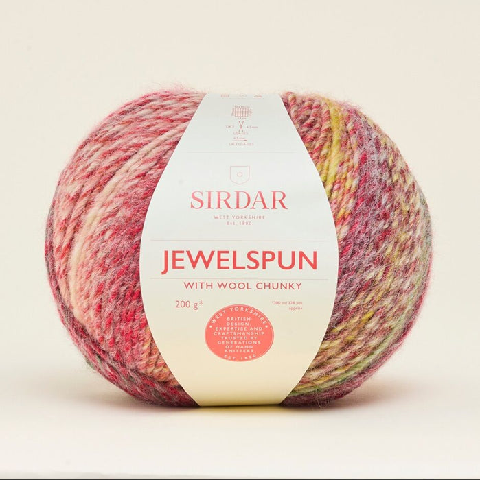 Sirdar Jewelspun yarn ball with label on a light beige background
