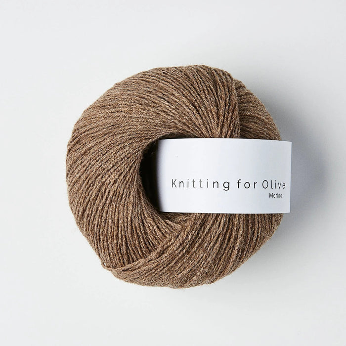 Ball of brown yarn with a 'Knitting for Olive' label on a white background