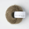 Ball of yarn with a 'Knitting for Olive' label on a white background