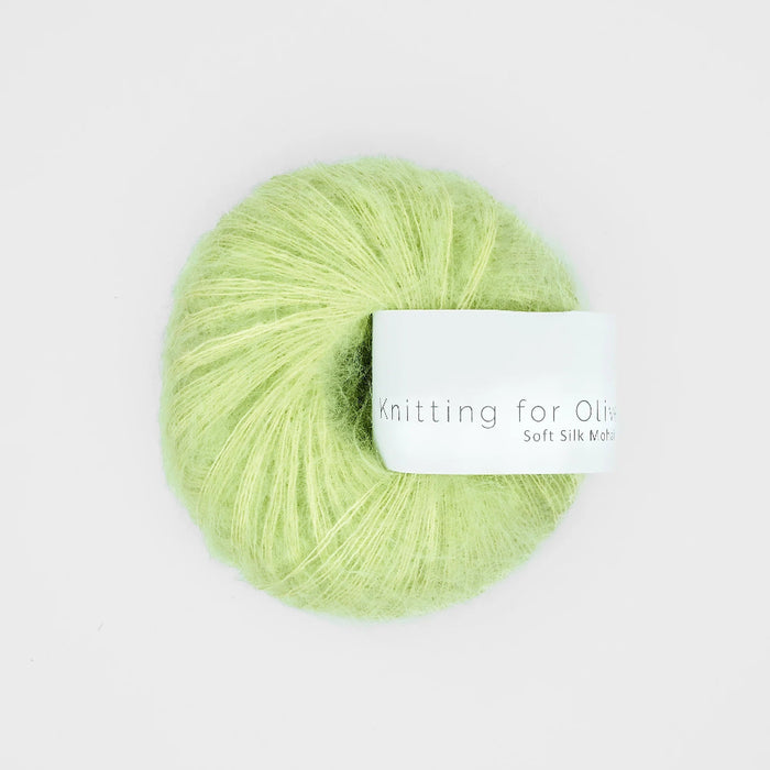 Light green skein of yarn with a label on a white background