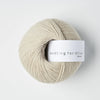 Ball of yarn with 'Knitting for Olive' label on a white background