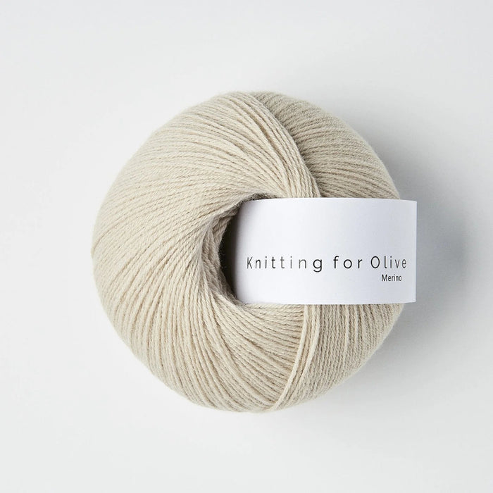 Ball of yarn with 'Knitting for Olive' label on a white background