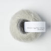 Ball of yarn with 'Knitting for Olive' label on a white background