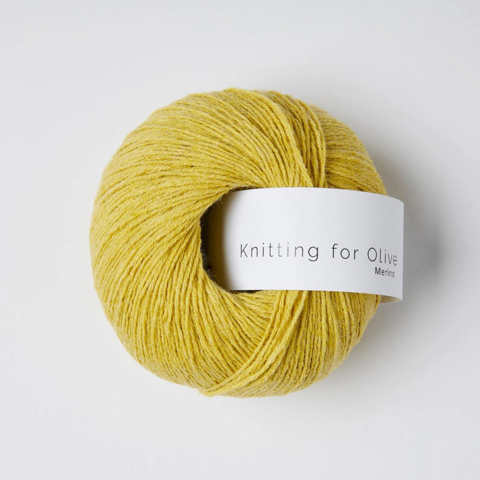Yellow skein of yarn with a 'Knitting for Olive' label on a white background