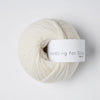 Ball of yarn with 'Knitting for Olive' label on a white background