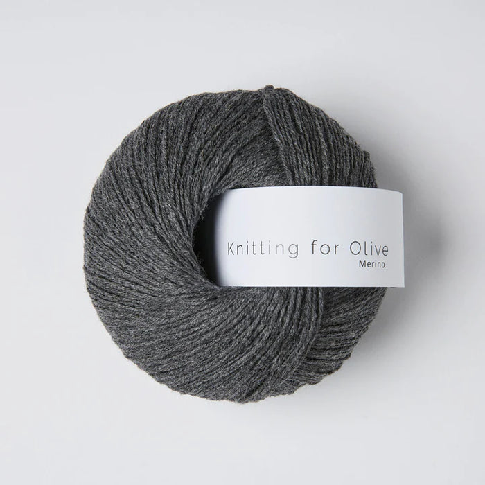 Gray skein of yarn with 'Knitting for Olive' label on a light gray background
