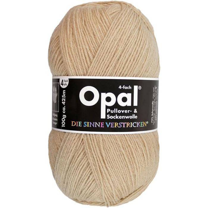 Ball of beige Opal yarn with a label on a white background