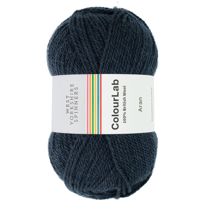 Ball of dark blue yarn with a ColourLab label on a white background