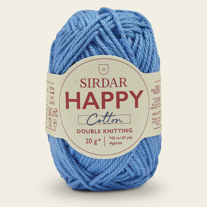 Blue ball of Sirdar Happy Cotton yarn on a light beige background