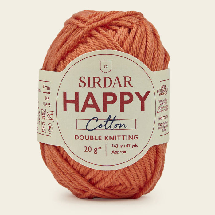 Ball of Sirdar Happy Cotton yarn on a beige background
