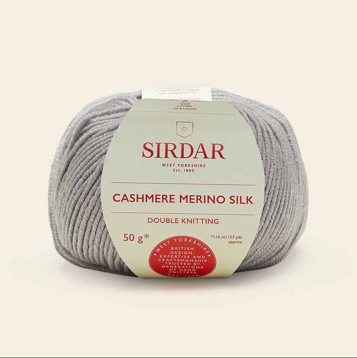 Ball of Sirdar cashmere merino silk yarn on a beige background