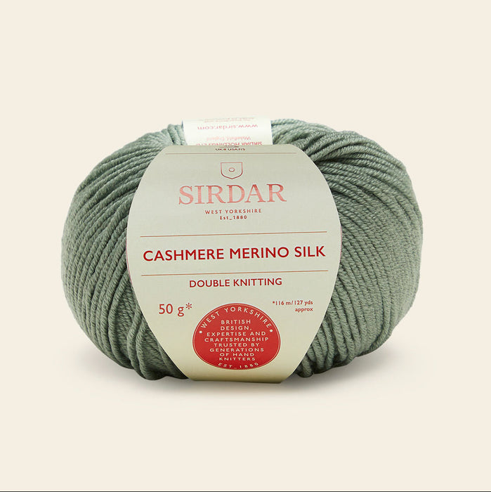 Ball of Sirdar cashmere merino silk yarn on a beige background