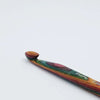 Colorful wooden crochet hook on a white background