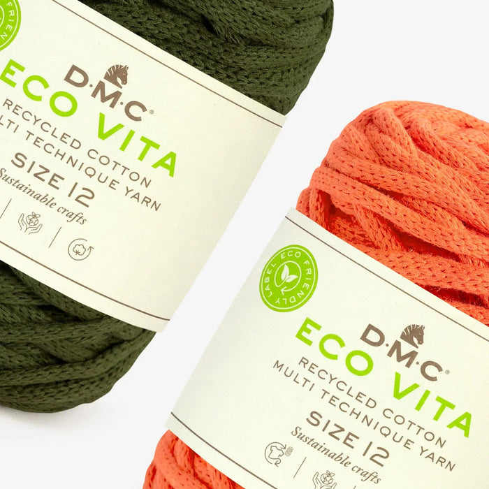 Two skeins of DMC Eco Vita yarn, one green and one orange, on a white background.