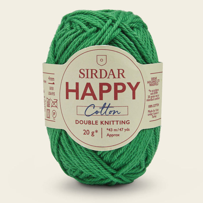 Green ball of Sirdar Happy Cotton yarn on a beige background