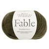 Ball of green yarn with a West Yorkshire Spinners label on a white background