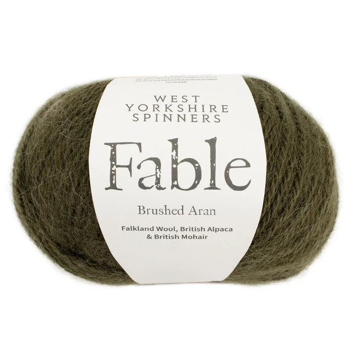 Ball of green yarn with a West Yorkshire Spinners label on a white background