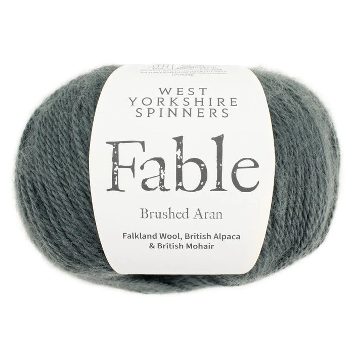 Ball of yarn with West Yorkshire Spinners Fable label on a white background